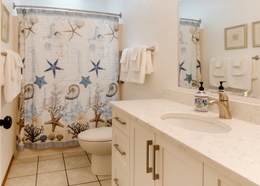 Forest cottages feature bathrooms with a bathtub and shower